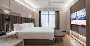 Voodi või voodid majutusasutuse Intercity Shenzhen Futian Huanggang with Free Mini Bar toas
