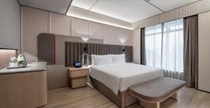 Voodi või voodid majutusasutuse Intercity Shenzhen Futian Huanggang with Free Mini Bar toas