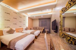 Postel nebo postele na pokoji v ubytování Oceanic Pearl Resort II + 28 fotografií