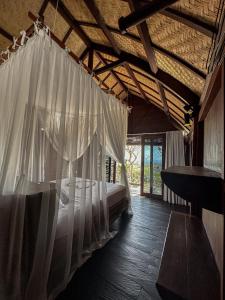 Ένα ή περισσότερα κρεβάτια σε δωμάτιο στο Divinity Villas - Uluwatu, Bali