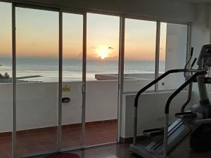 a gym with a view of the ocean at Breathtaking Luxury in Negombo in Negombo