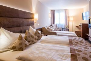 Voodi või voodid majutusasutuse Hotel König toas