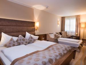 Voodi või voodid majutusasutuse Hotel König toas