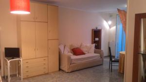 a living room with a couch and a cabinet at Ciao Bello B&B in Martina Franca