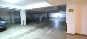 an empty parking garage with a car parked in it at Breathtaking Luxury in Negombo in Negombo