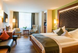 Voodi või voodid majutusasutuse Hotel König toas