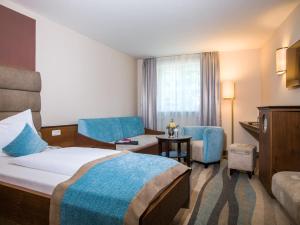 Voodi või voodid majutusasutuse Hotel König toas