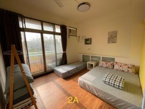 Letto o letti in una camera di HeMei Homestay