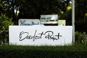 a sign that says garden picks on a white sign at Barefoot Project formerly Baan Klong Kleng in Ko Phayam