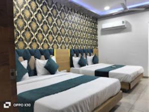 Postelja oz. postelje v sobi nastanitve Hotel Rudra Palace , Anand