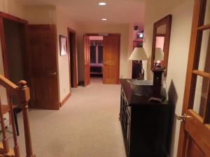 a hallway of a hotel room with a sink at Lux 5BR 4BA SV125 SKI In Out, 18-hole Championship Golf Course, Water Park, pet friendly in Jay