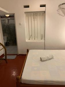 Letto o letti in una camera di Unrushed Midigama