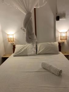 Letto o letti in una camera di Unrushed Midigama