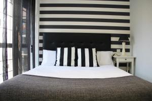 Cama o camas de una habitación en Apartamentos Vino y Camino