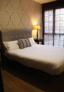 Cama o camas de una habitación en Apartamentos Vino y Camino