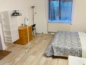 Postel nebo postele na pokoji v ubytování Apartmán v zahradě Malšovice