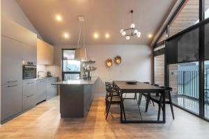a kitchen and dining room with a table and chairs at Luxury down town/Free parking in Reykjavík