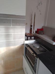a kitchen with a stove and a counter top at Mountain view apartment in Makadi Heights in Hurghada