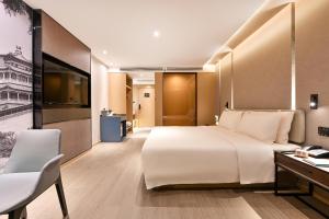 Postel nebo postele na pokoji v ubytování Atour S Hotel Beijing Anzhen