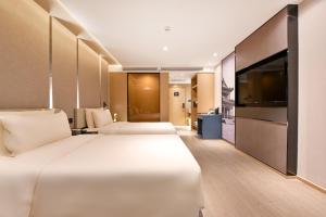 Postel nebo postele na pokoji v ubytování Atour S Hotel Beijing Anzhen