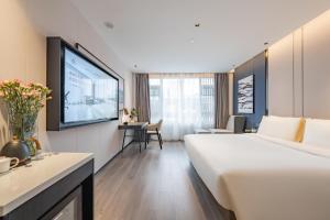 Postel nebo postele na pokoji v ubytování Atour Hotel Shanghai Zhangjiang Park Science City