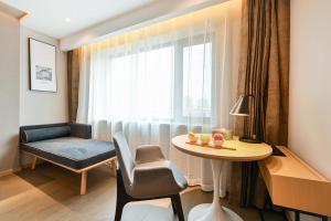 Posezení v ubytování Atour S Hotel Beijing Anzhen + 11 fotografií
