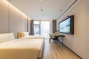Postel nebo postele na pokoji v ubytování Atour Hotel Shanghai Zhangjiang Park Science City