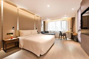 Postel nebo postele na pokoji v ubytování Atour S Hotel Beijing Anzhen