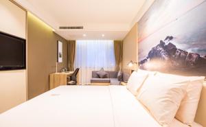 Postel nebo postele na pokoji v ubytování Atour Hotel Weihai City Center