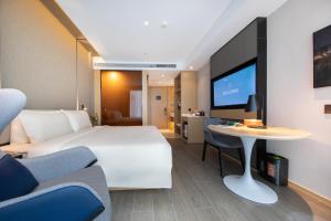 Postel nebo postele na pokoji v ubytování Atour Hotel Shanghai Wujiaochang Daxue Road