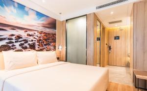 Postel nebo postele na pokoji v ubytování Atour Hotel Weihai City Center