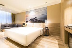 Postel nebo postele na pokoji v ubytování Atour Hotel Weihai City Center