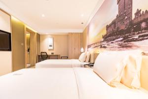 Postel nebo postele na pokoji v ubytování Atour Hotel Weihai City Center