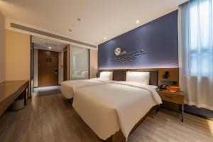 Postel nebo postele na pokoji v ubytování Atour X Hotel Beijing Sanyuan Bridge