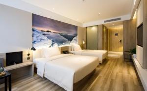 Postel nebo postele na pokoji v ubytování Atour Hotel Shenyang Hunnan Olympic Sports Center