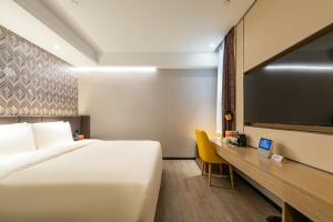Postel nebo postele na pokoji v ubytování Atour X Hotel Beijing Sanyuan Bridge