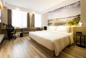 Postel nebo postele na pokoji v ubytování Atour Hotel Shenyang Hunnan Olympic Sports Center