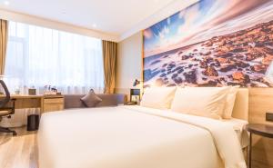 Postel nebo postele na pokoji v ubytování Atour Hotel Weihai City Center
