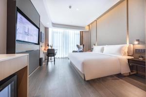Postel nebo postele na pokoji v ubytování Atour Hotel Shanghai Wujiaochang Daxue Road