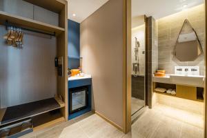 a bathroom with a sink and a shower at Atour Hotel Hangzhou Qiandao Lake Central Dock in Chun'an