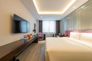 Postel nebo postele na pokoji v ubytování Atour X Hotel Beijing Sanyuan Bridge