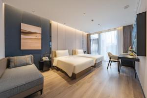 Postel nebo postele na pokoji v ubytování Atour Hotel Shanghai Zhangjiang Park Science City