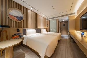 Postel nebo postele na pokoji v ubytování Atour X Hotel Beijing Sanyuan Bridge