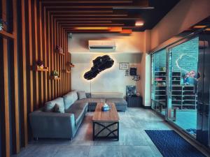 a living room with a couch and a table at 98Inn in Xiaoliuqiu
