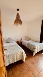 Кровать или кровати в номере Wakanda House Fuerteventura