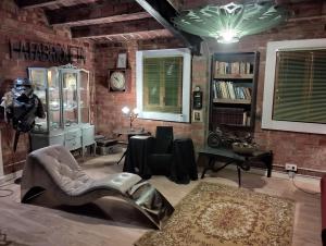 a living room with a brick wall at La Fabriqueta Suite in Ríudecañas