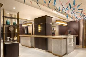 a large kitchen with a counter with aitating at Bentley Hotel Old City-Special Class in Istanbul +88 photos