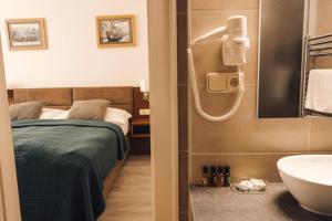 Kúpeľňa v ubytovaní U Medvidku-Brewery Hotel