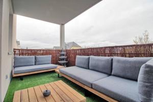 Posezení v ubytování Appartement - Note Boisée - Terrasse & Parking