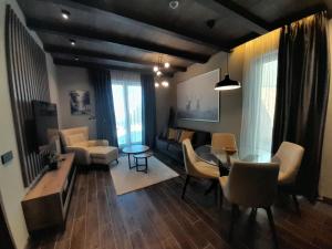 Coin salon dans l'établissement Woodside RENT Kopaonik